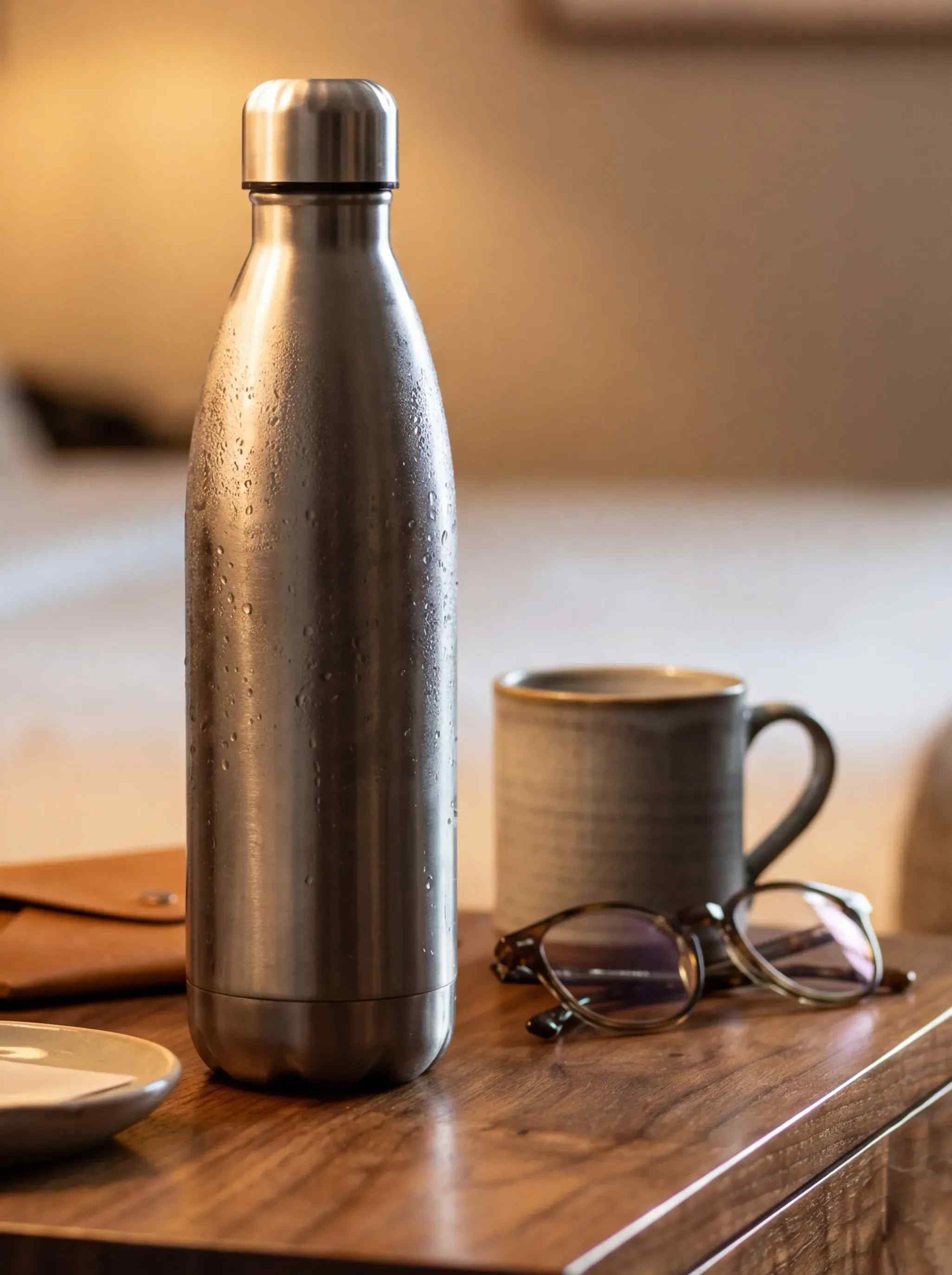 A water bottle and coffee mug.